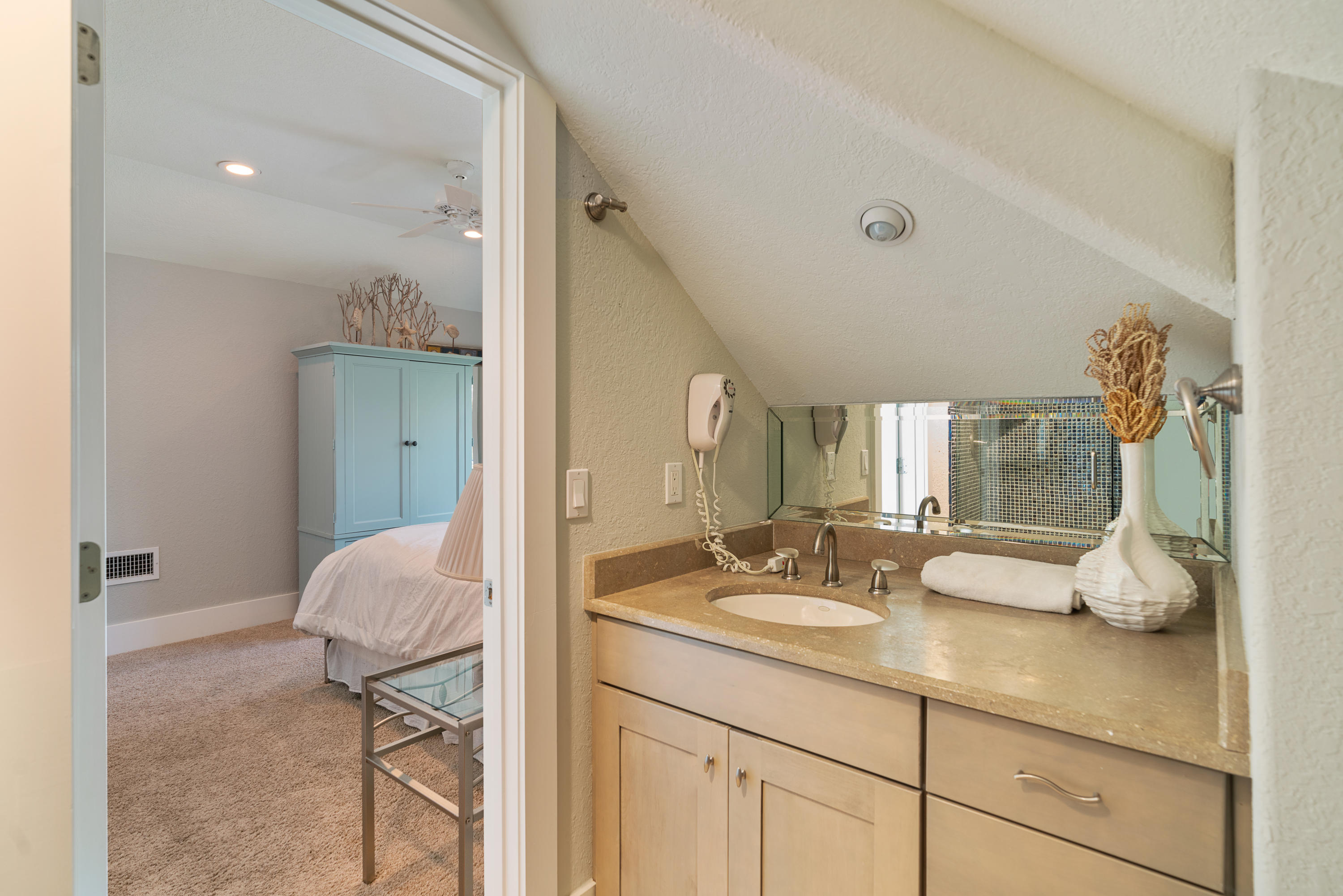 98 Pine Crest Circle Inlet Beach, FL 32461 - Photo 48 of 66 a en suite bathroom with a granite countertop sink mirror and toilet