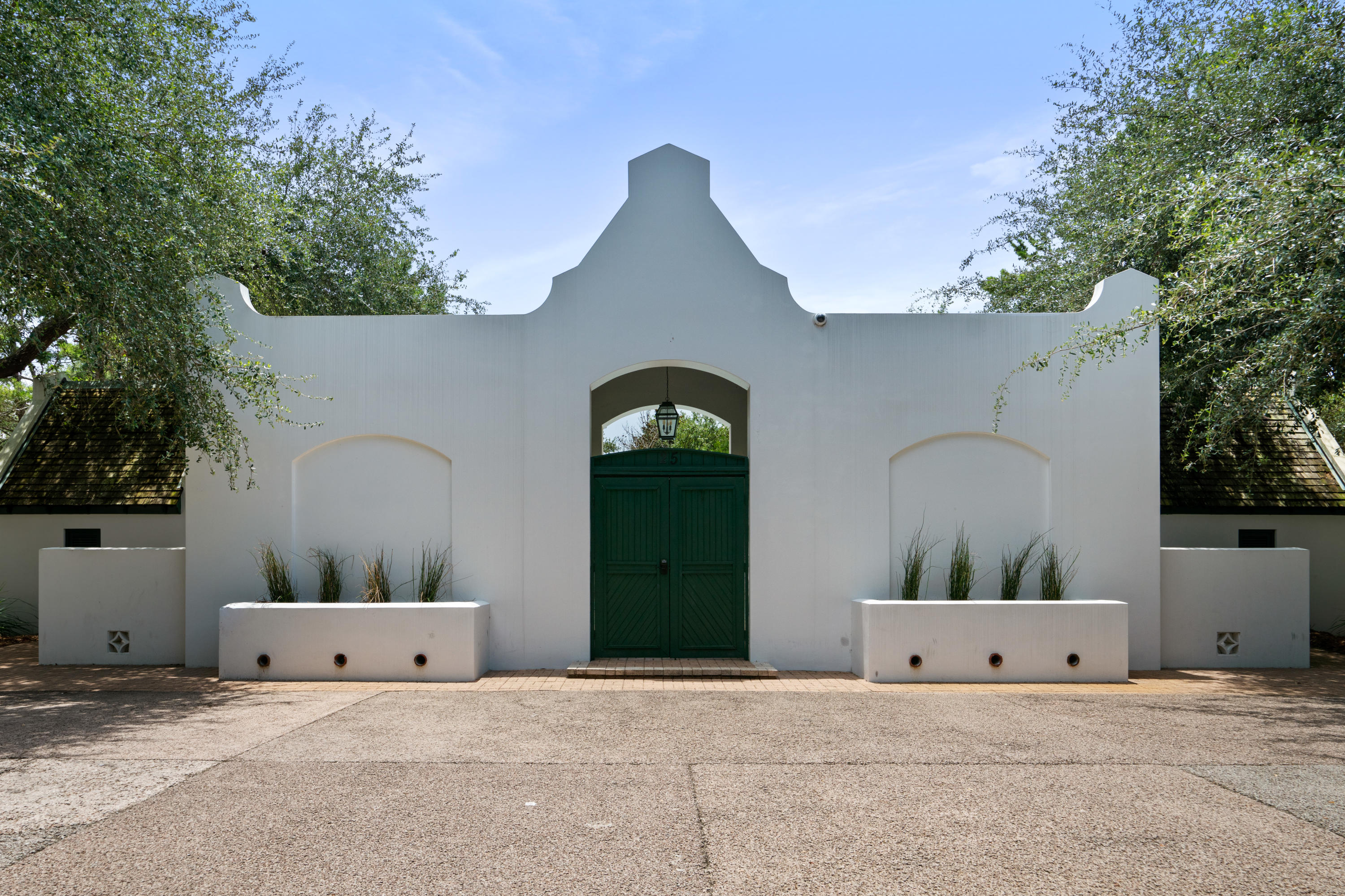 98 Pine Crest Circle Inlet Beach, FL 32461 - Photo 50 of 66 a front view of a house with a garden