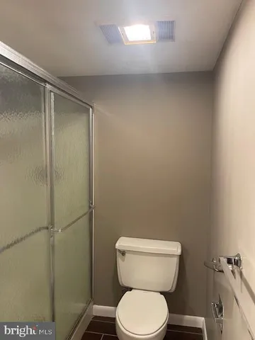 a bathroom with a sink vanity and mirror