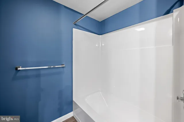 a bathroom with a sink toilet and mirror