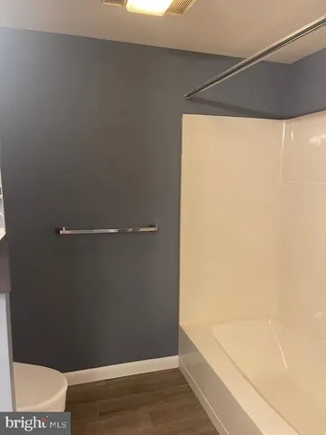 a bathroom with a sink vanity and mirror