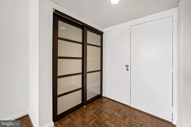 a view of staircase with white walls