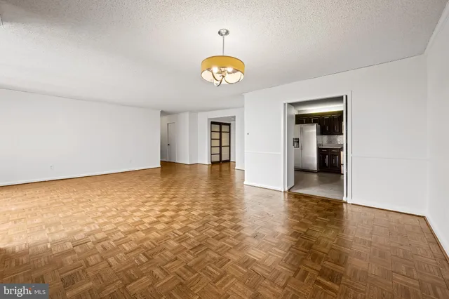 a view of an empty room with a window