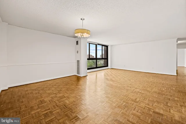 a view of an empty room with a window