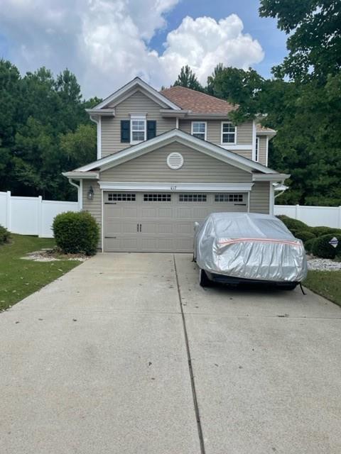 417 Silver Spring Street Dallas, GA 30157 - Photo 1 of 1 a front view of a house with a yard and garage