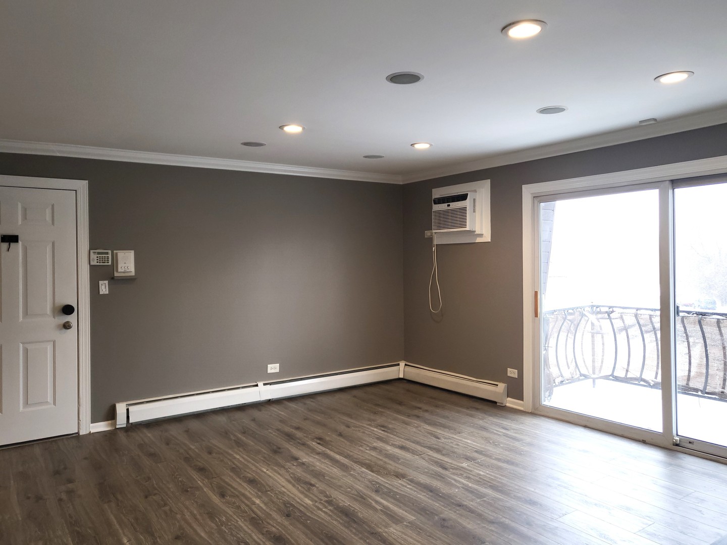 4809 West Engle Road, Unit 3A Alsip, IL 60803 - Photo 10 of 11 an empty room with wooden floor and windows