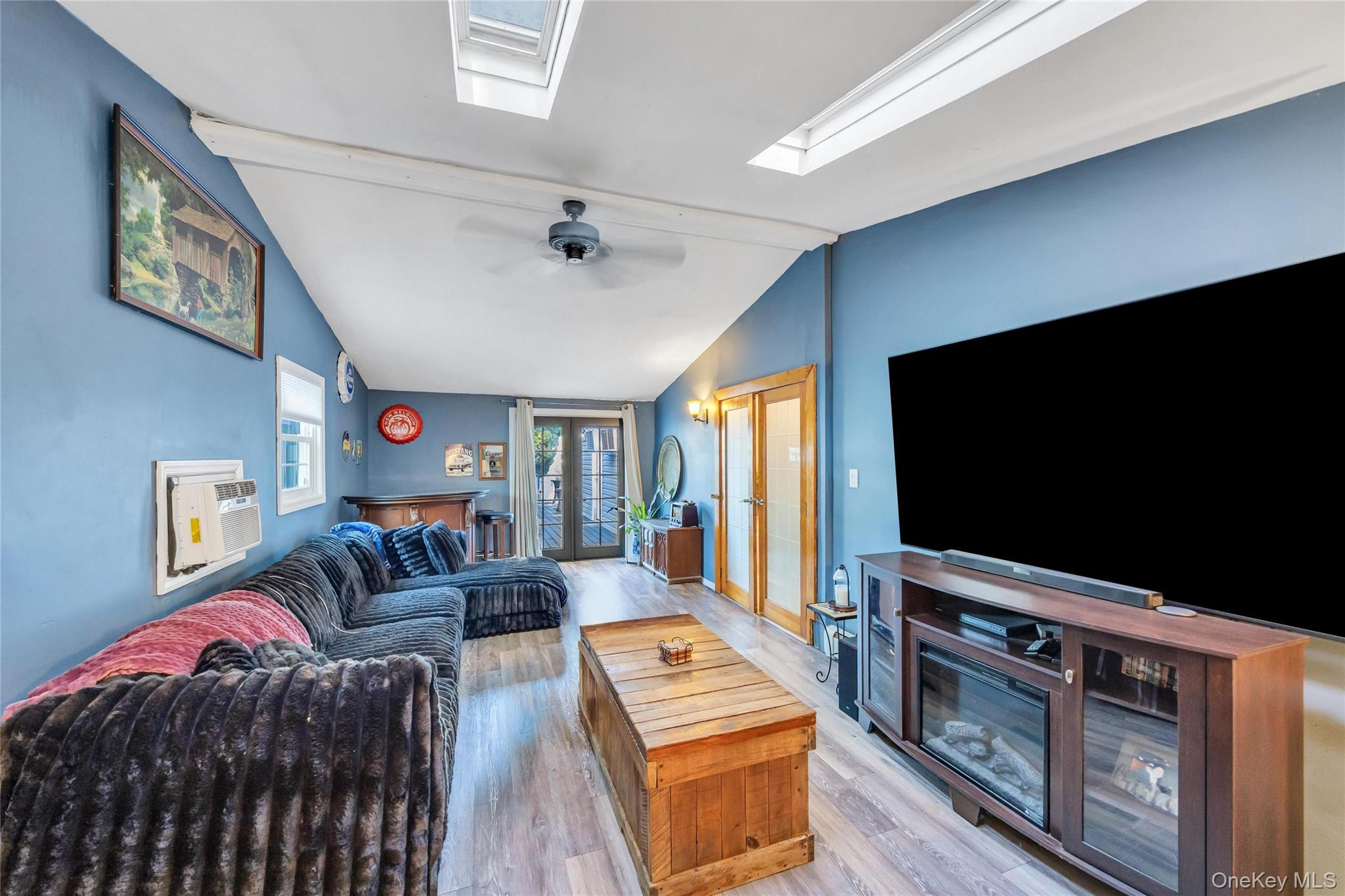 7 Amherst Road Ronkonkoma, NY 11779 - Photo 23 of 36 a living room with furniture and a flat screen tv