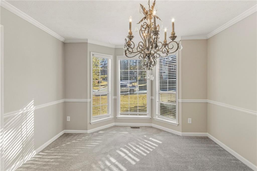 715 Welford Road Northwest Suwanee, GA 30024 - Photo 12 of 50 a view of an empty room with a window