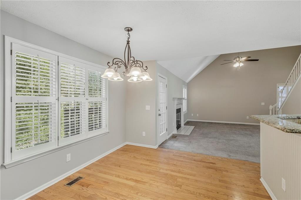 715 Welford Road Northwest Suwanee, GA 30024 - Photo 16 of 50 a view of a livingroom with a chandelier