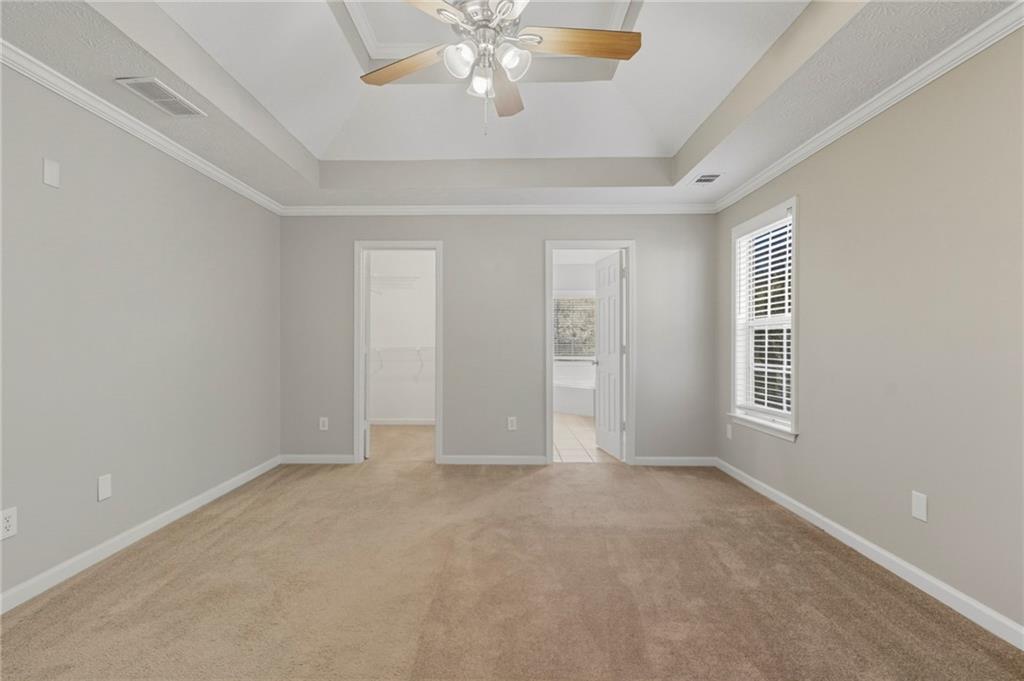 715 Welford Road Northwest Suwanee, GA 30024 - Photo 22 of 50 a view of an empty room with a window