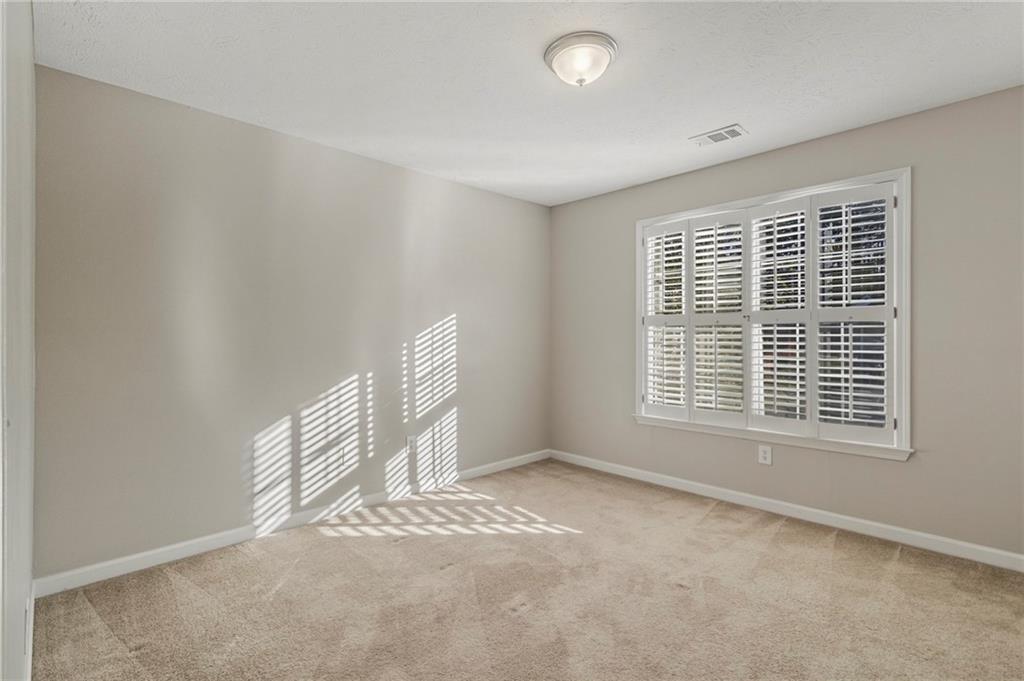 715 Welford Road Northwest Suwanee, GA 30024 - Photo 25 of 50 a view of an empty room with a window