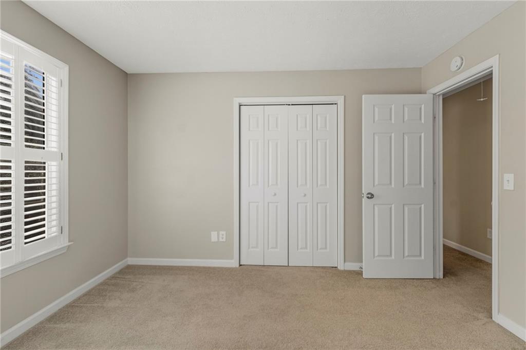 715 Welford Road Northwest Suwanee, GA 30024 - Photo 26 of 50 an empty room with windows
