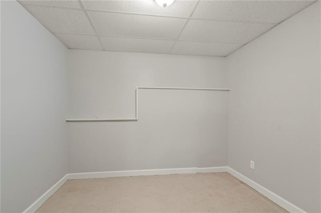 715 Welford Road Northwest Suwanee, GA 30024 - Photo 31 of 50 a view of a room with racks on the wall