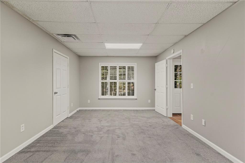 715 Welford Road Northwest Suwanee, GA 30024 - Photo 33 of 50 a view of an empty room with a window