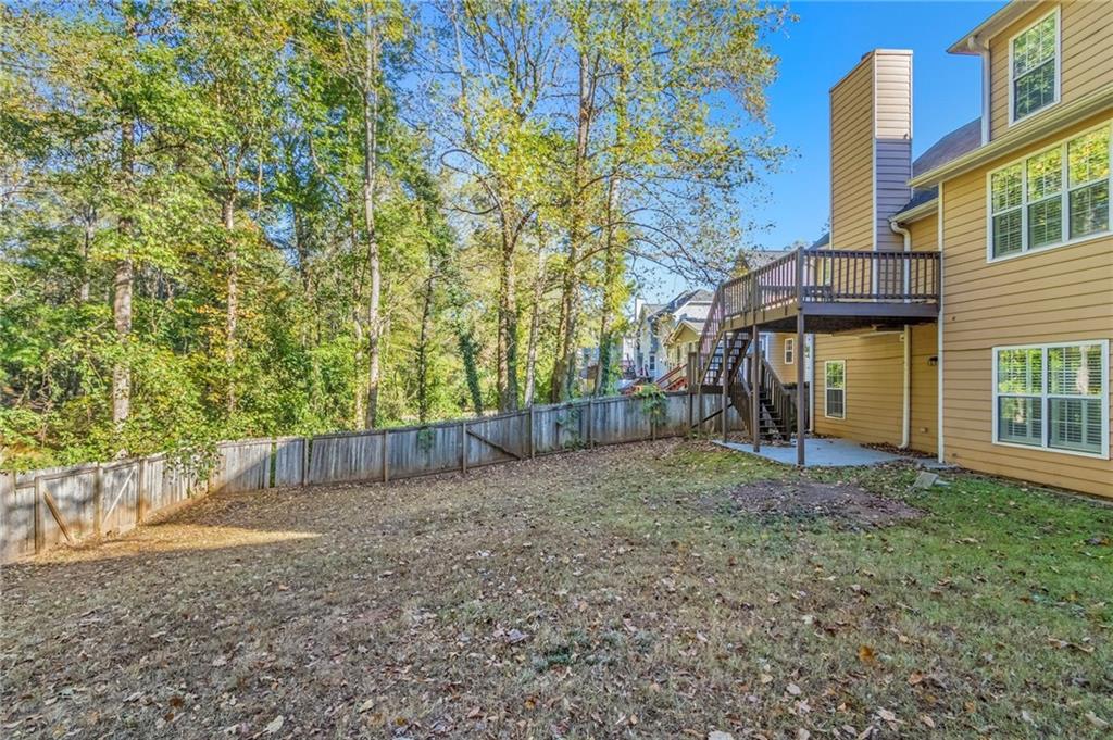 715 Welford Road Northwest Suwanee, GA 30024 - Photo 45 of 50 front view of a house with a yard