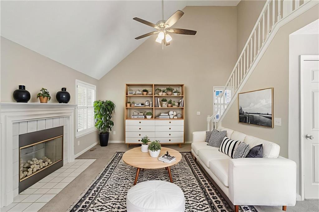 715 Welford Road Northwest Suwanee, GA 30024 - Photo 5 of 50 a living room with furniture and a fireplace