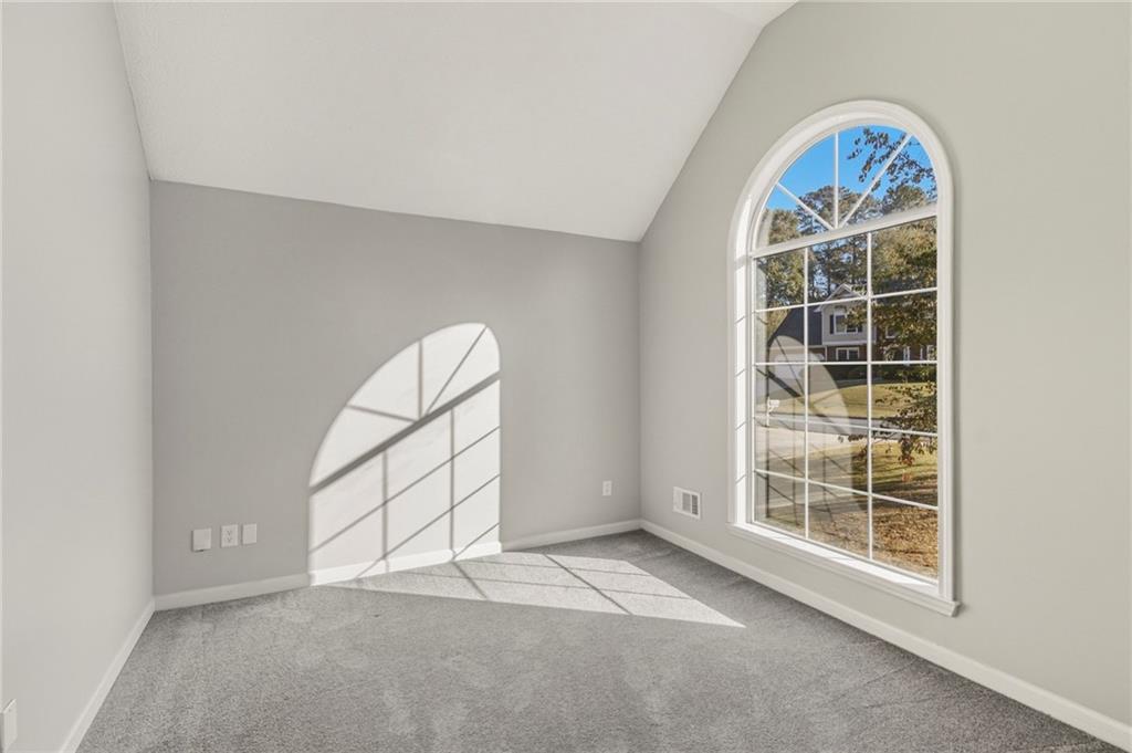 715 Welford Road Northwest Suwanee, GA 30024 - Photo 10 of 50 an empty room with windows