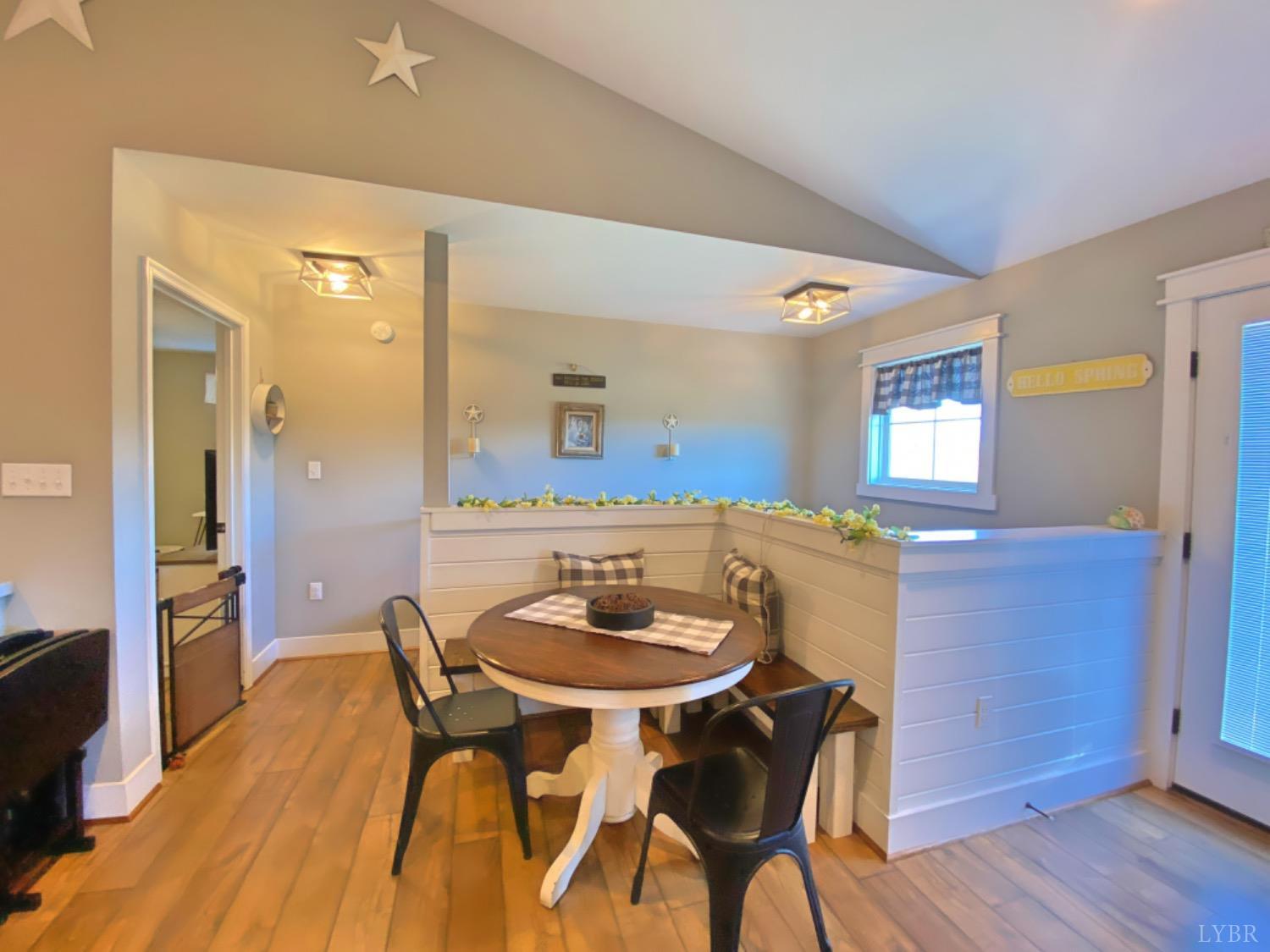 2484 Red House Road Rustburg, VA 24588 - Photo 17 of 29 a dining room with furniture and wooden floor