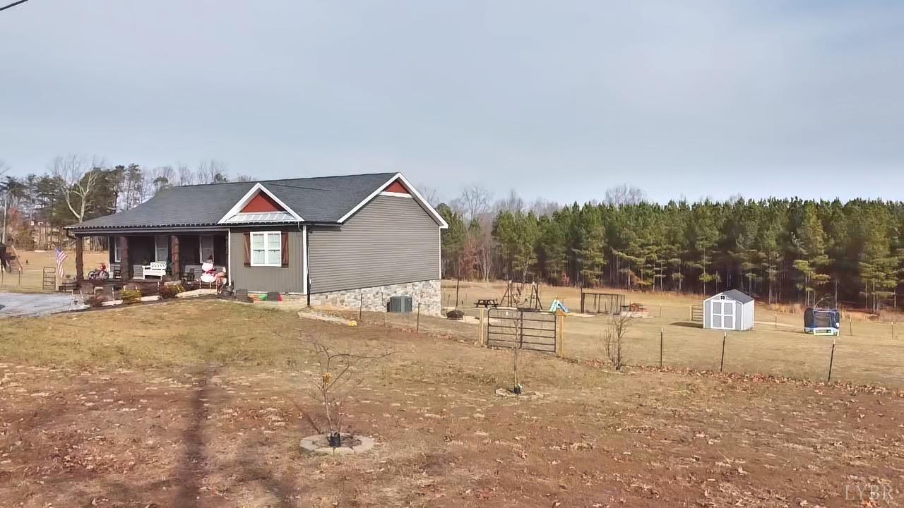 2484 Red House Road Rustburg, VA 24588 - Photo 5 of 29 a front view of a house with a yard