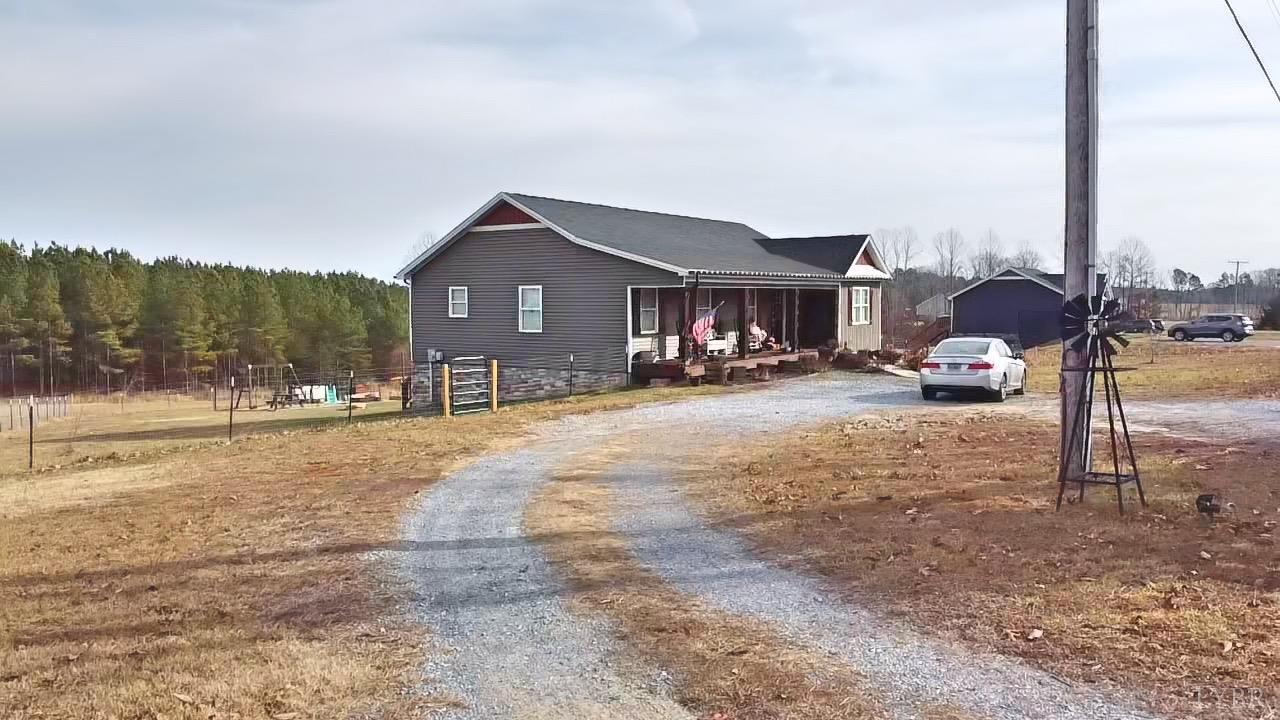 2484 Red House Road Rustburg, VA 24588 - Photo 7 of 29 a street view with residential house and cars parked in front of it