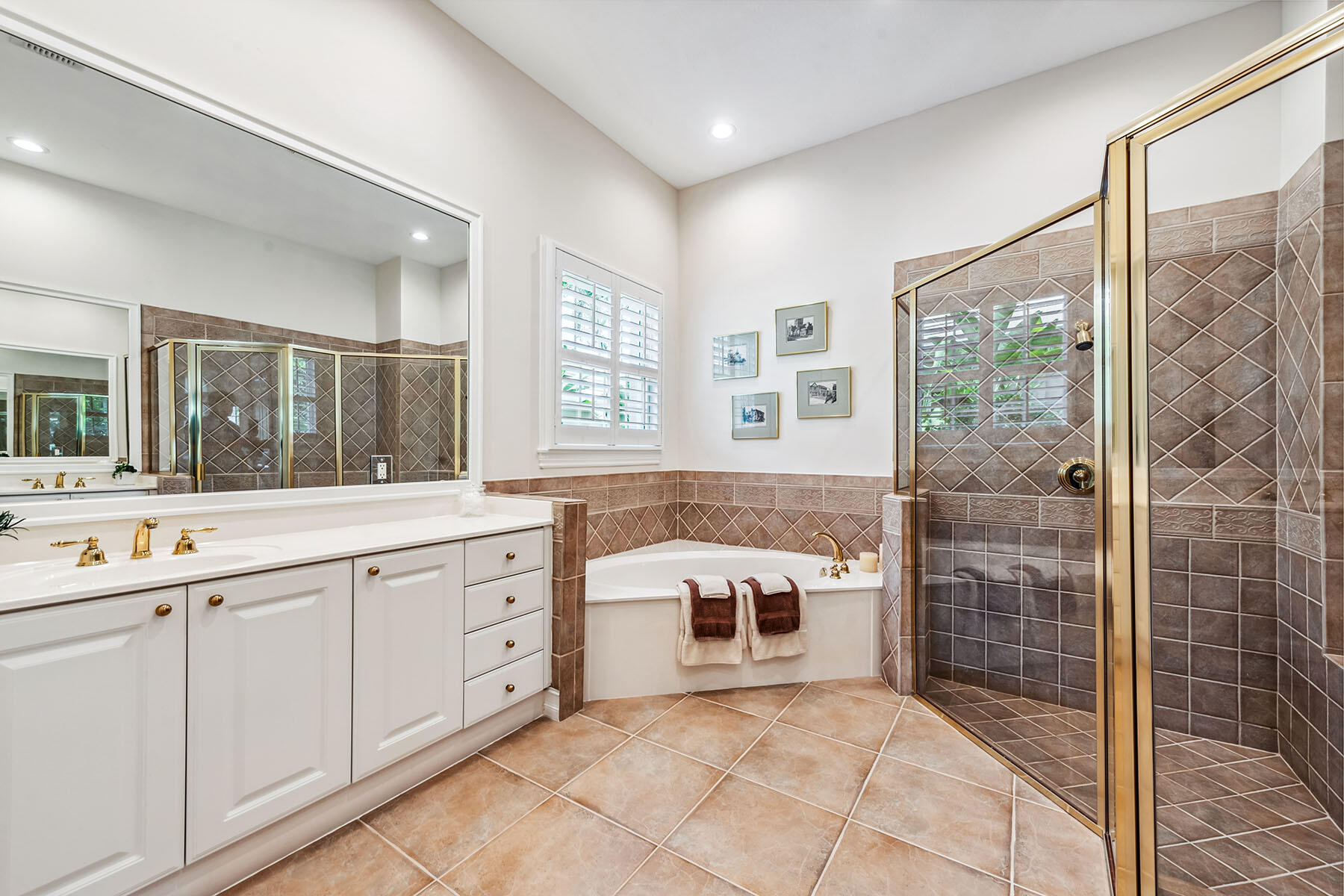 8499 Mallards Way Naples, FL 34114 - Photo 15 of 50 a spacious bathroom with a granite countertop sink a mirror and a shower
