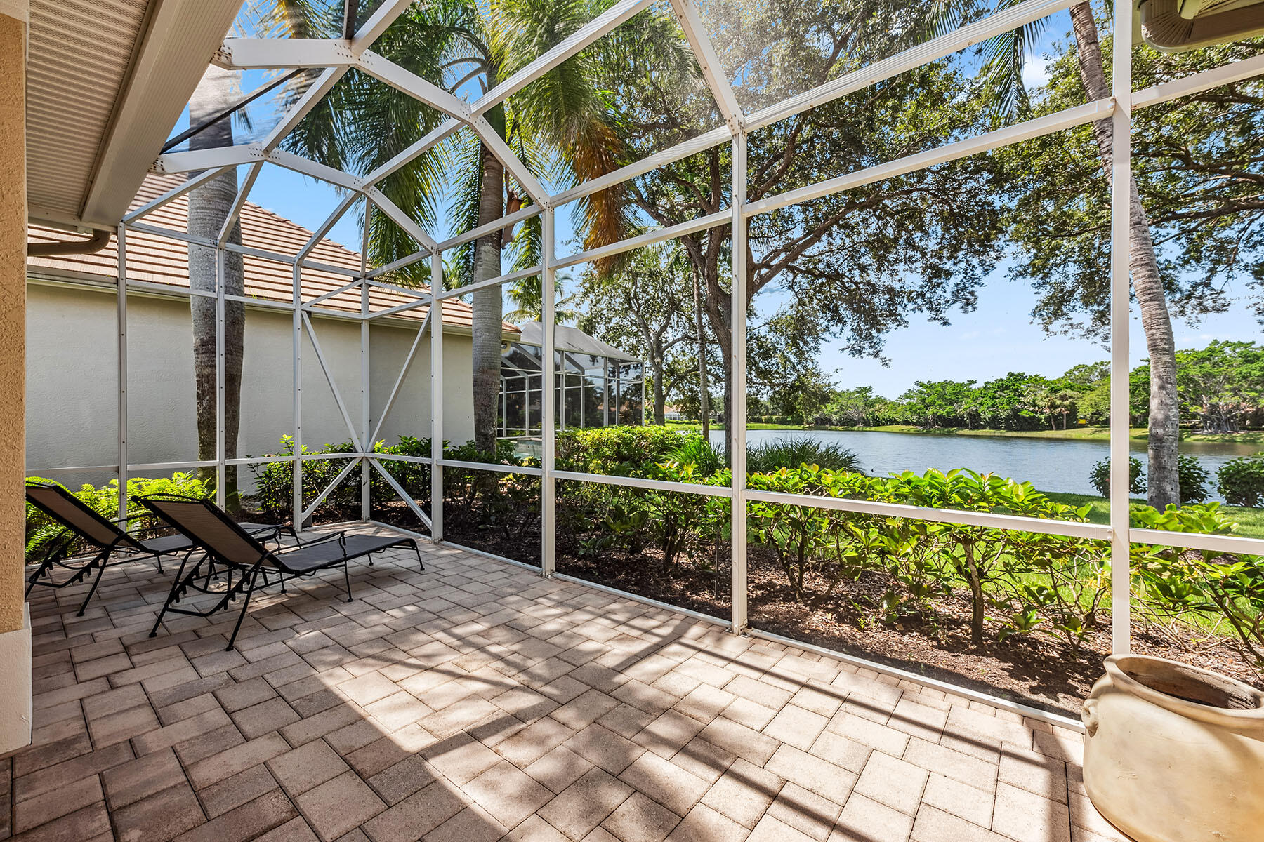 8499 Mallards Way Naples, FL 34114 - Photo 23 of 50 a house view with a seating space and a wooden fence