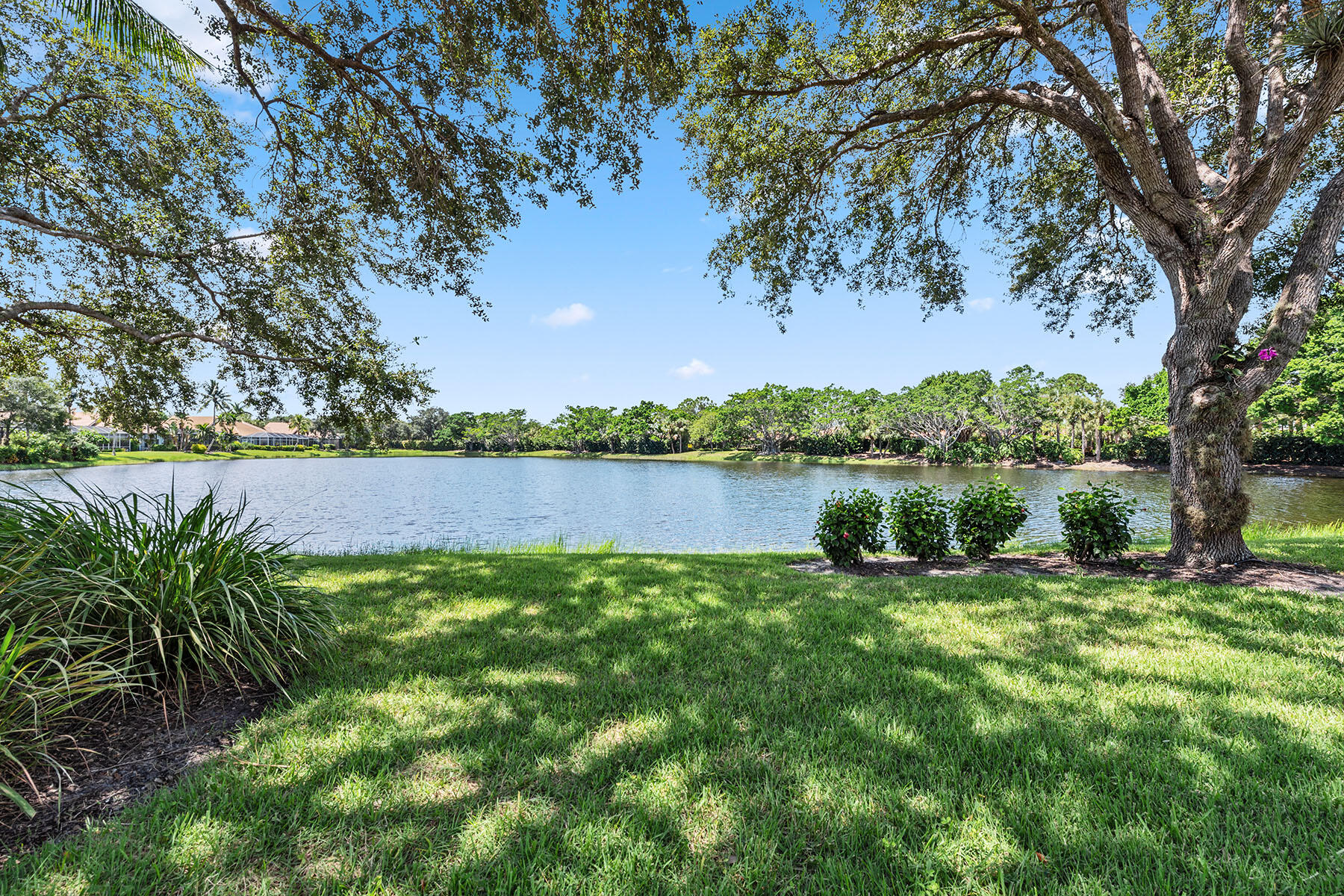8499 Mallards Way Naples, FL 34114 - Photo 26 of 50 a view of a lake with houses in the back