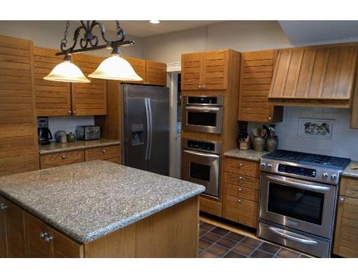 150 Moffat Road Newton, MA 02468 - Photo 8 of 18 a kitchen with a stove kitchen island and stainless steel appliances