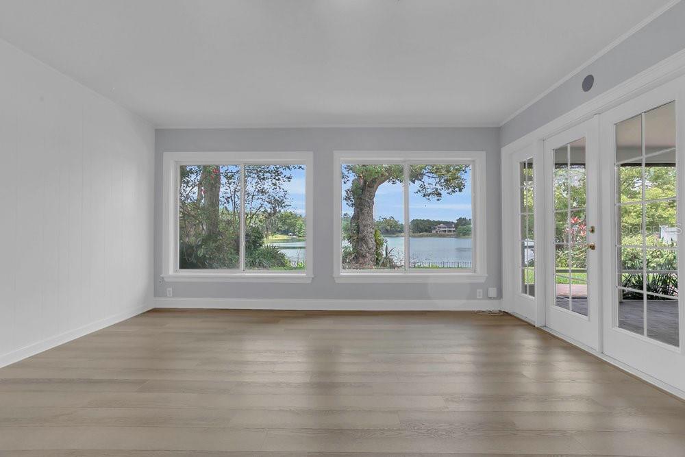 3605 Pershing Avenue Orlando, FL 32812 - Photo 12 of 35 a view of room with window and wooden floor