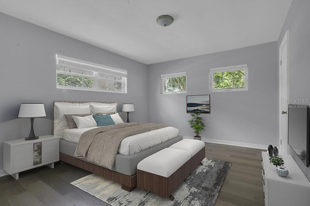 3605 Pershing Avenue Orlando, FL 32812 - Photo 19 of 35 a bedroom with a bed and a couch