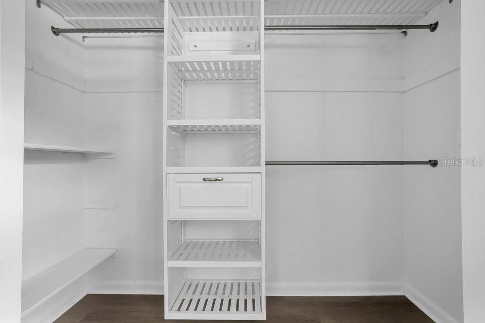 3605 Pershing Avenue Orlando, FL 32812 - Photo 20 of 35 a walk in closet with wooden floor