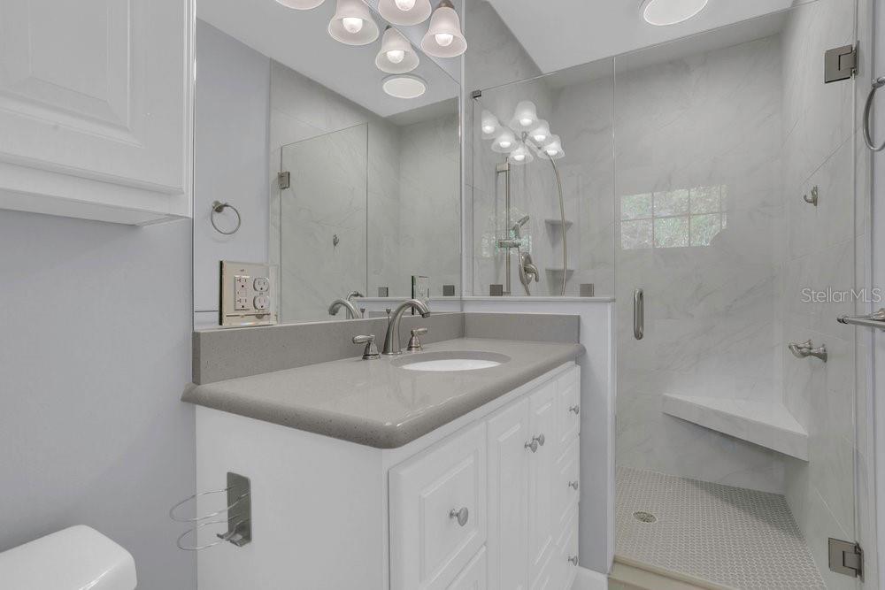 3605 Pershing Avenue Orlando, FL 32812 - Photo 21 of 35 a bathroom with a sink vanity granite and toilet