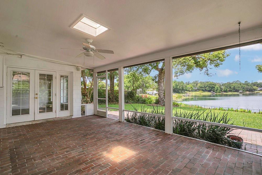 3605 Pershing Avenue Orlando, FL 32812 - Photo 24 of 35 a view of a room with a large window and wooden floor