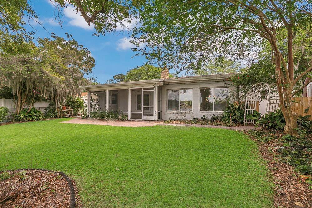 3605 Pershing Avenue Orlando, FL 32812 - Photo 28 of 35 a front view of a house with a garden