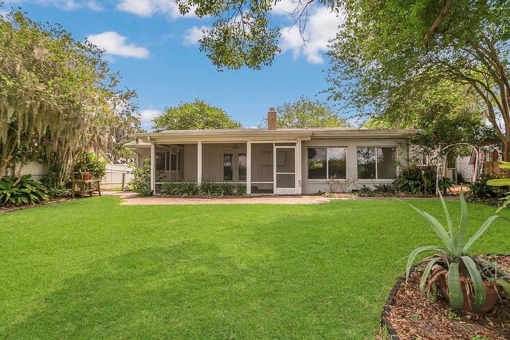 3605 Pershing Avenue Orlando, FL 32812 - Photo 29 of 35 a view of a house with a backyard