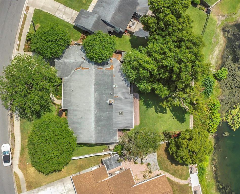3605 Pershing Avenue Orlando, FL 32812 - Photo 33 of 35 an aerial view of a house with a yard
