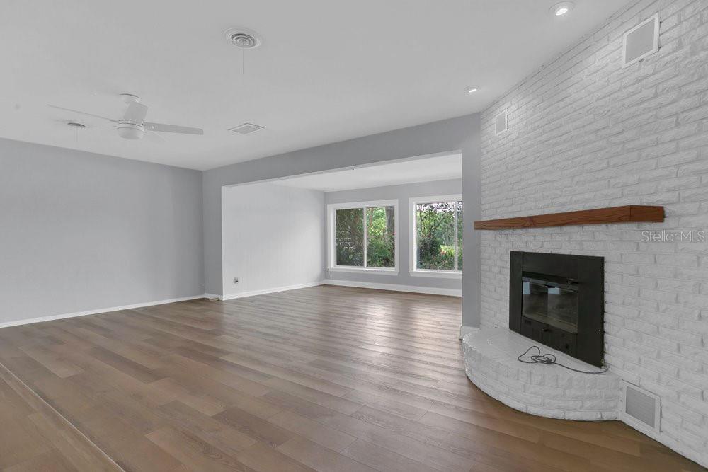 3605 Pershing Avenue Orlando, FL 32812 - Photo 5 of 35 a view of a livingroom with a fireplace and window