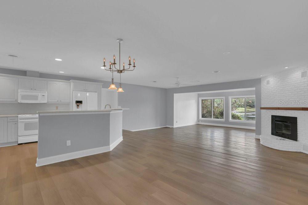 3605 Pershing Avenue Orlando, FL 32812 - Photo 6 of 35 a view of livingroom and kitchen with hardwood floor