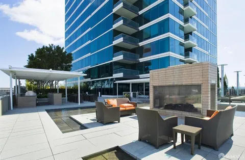 a view of a patio with a table and chairs