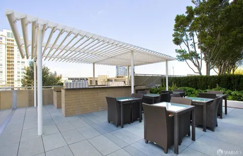 a view of a terrace with furniture and garden