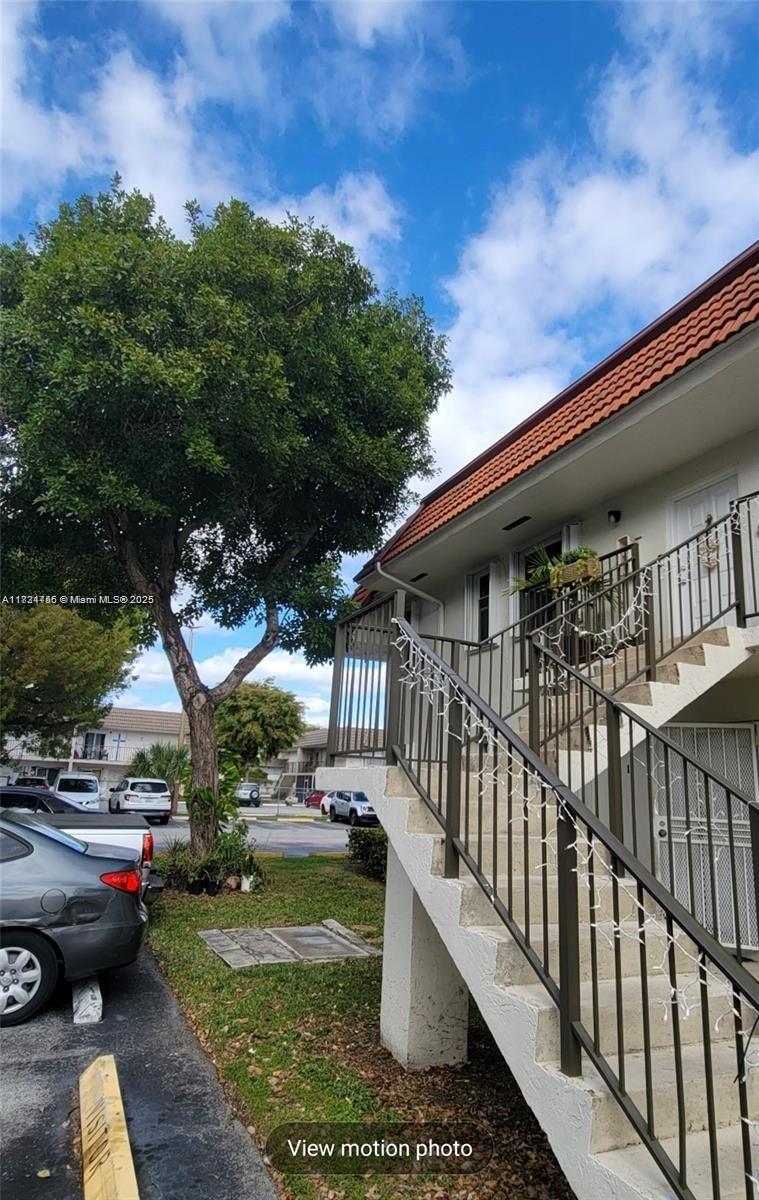 7121 Southwest 129th Avenue, Unit 5 Miami, FL 33183 - Photo 18 of 19 a view of a house with backyard and sitting area