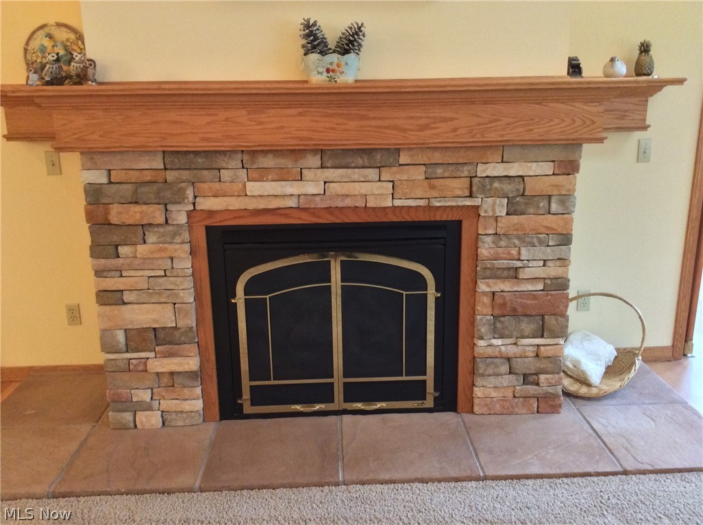 3400 Church Road Medina, OH 44256 - Photo 7 of 24 GAS FIREPLACE WITH STACKED STONE & MANTLE.