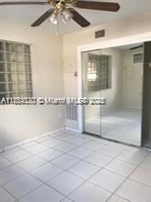 3121 Northwest 103rd Street, Unit 3 Miami, FL 33147 - Photo 2 of 6 a bathroom with a bathtub and shower