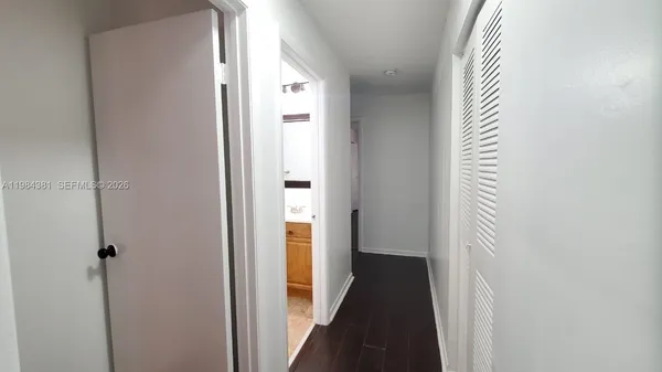 a view of a hallway with a large window