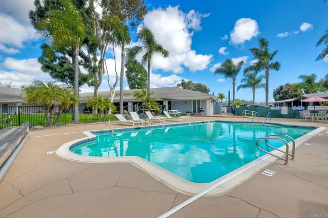 a view of a swimming pool with a patio