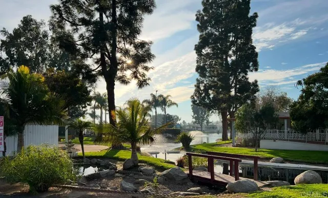 a view of a table and chairs in patio and a yard