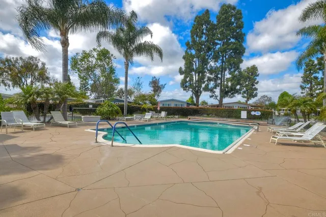 a view of a room with a chandelier and living room view
