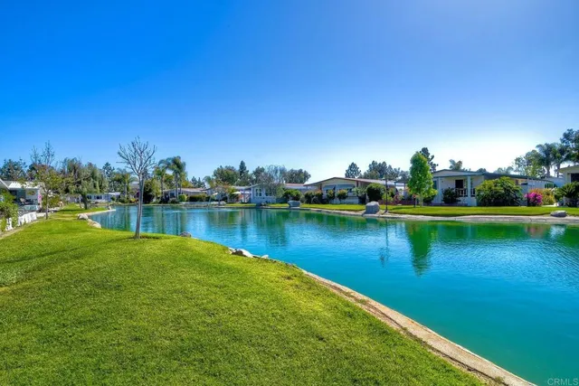 a spacious bedroom with a bed and a large window