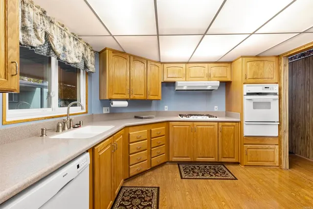 a kitchen with a sink and cabinets