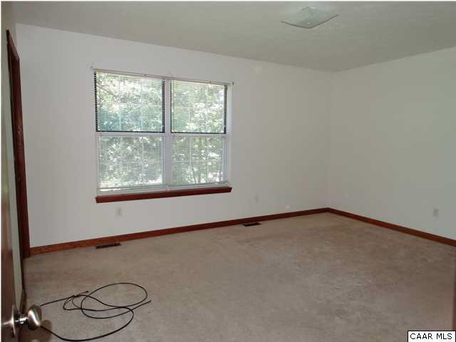 14121 Reva Road Boston, VA 22713 - Photo 11 of 16 a view of a room with rack on the wall and a window